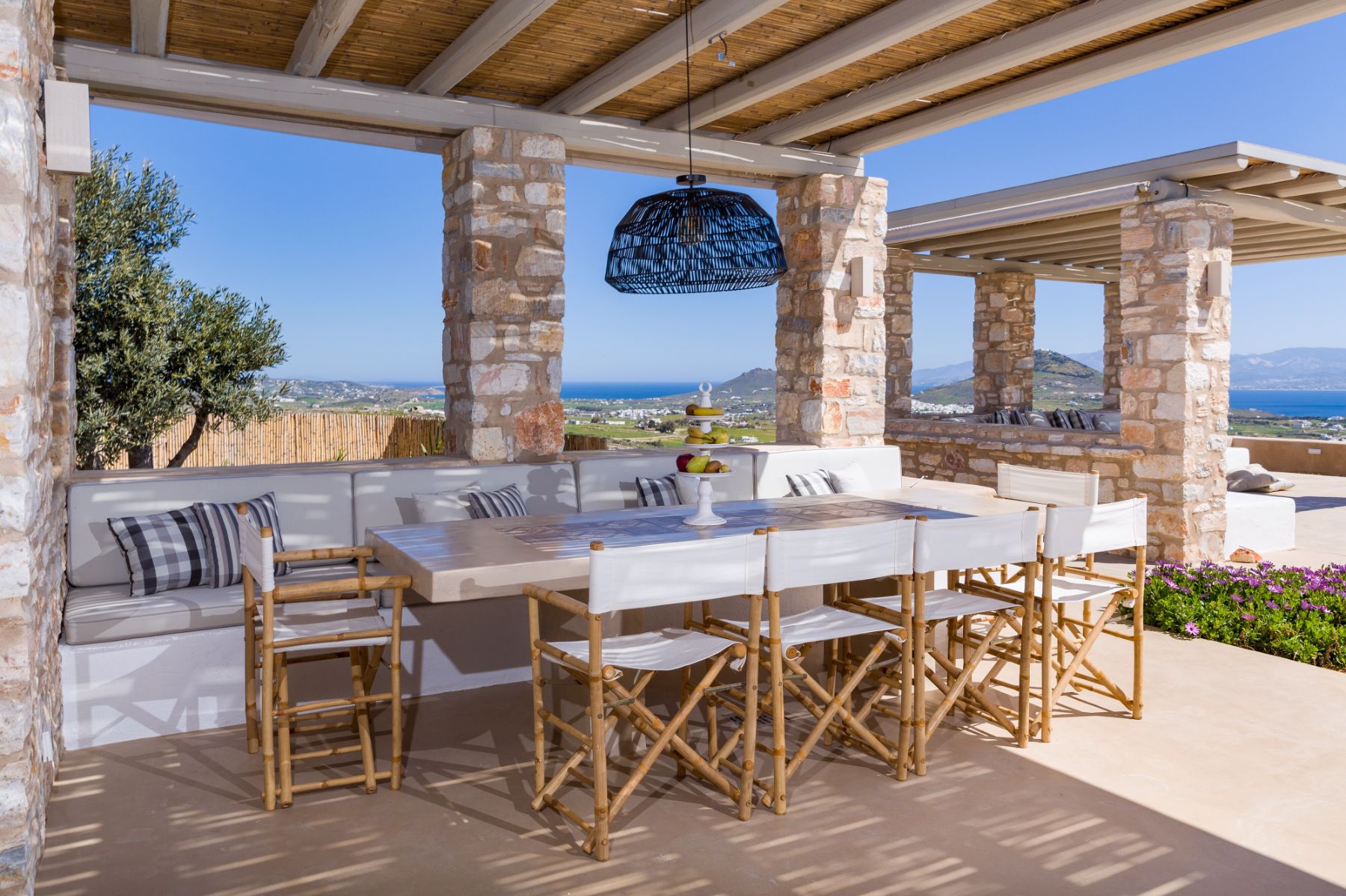 Outdoor covered dining terrace at Villa Livadi, Paros