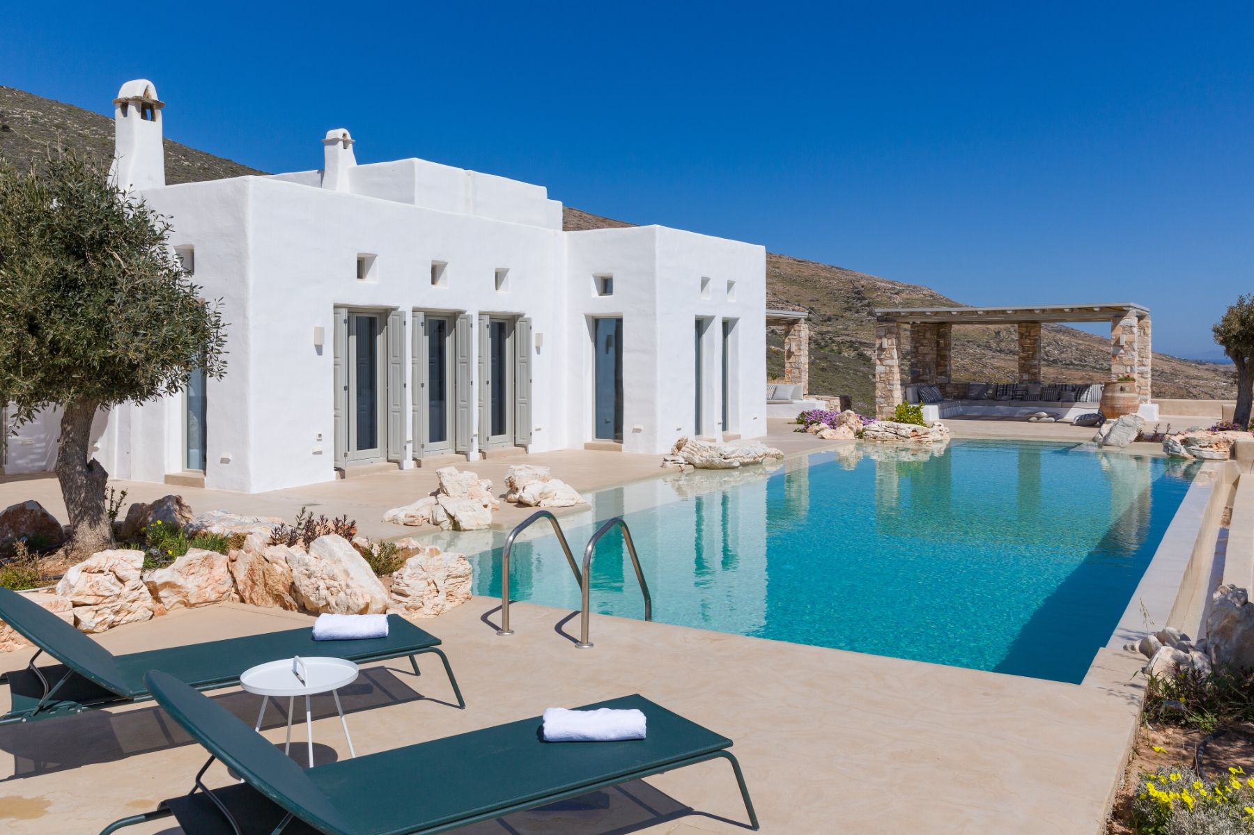Pool with sun loungers at Villa Livadi, Paros