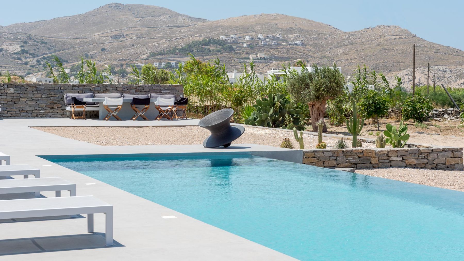 Pool and view of mountains at Villa Nisi, Paros