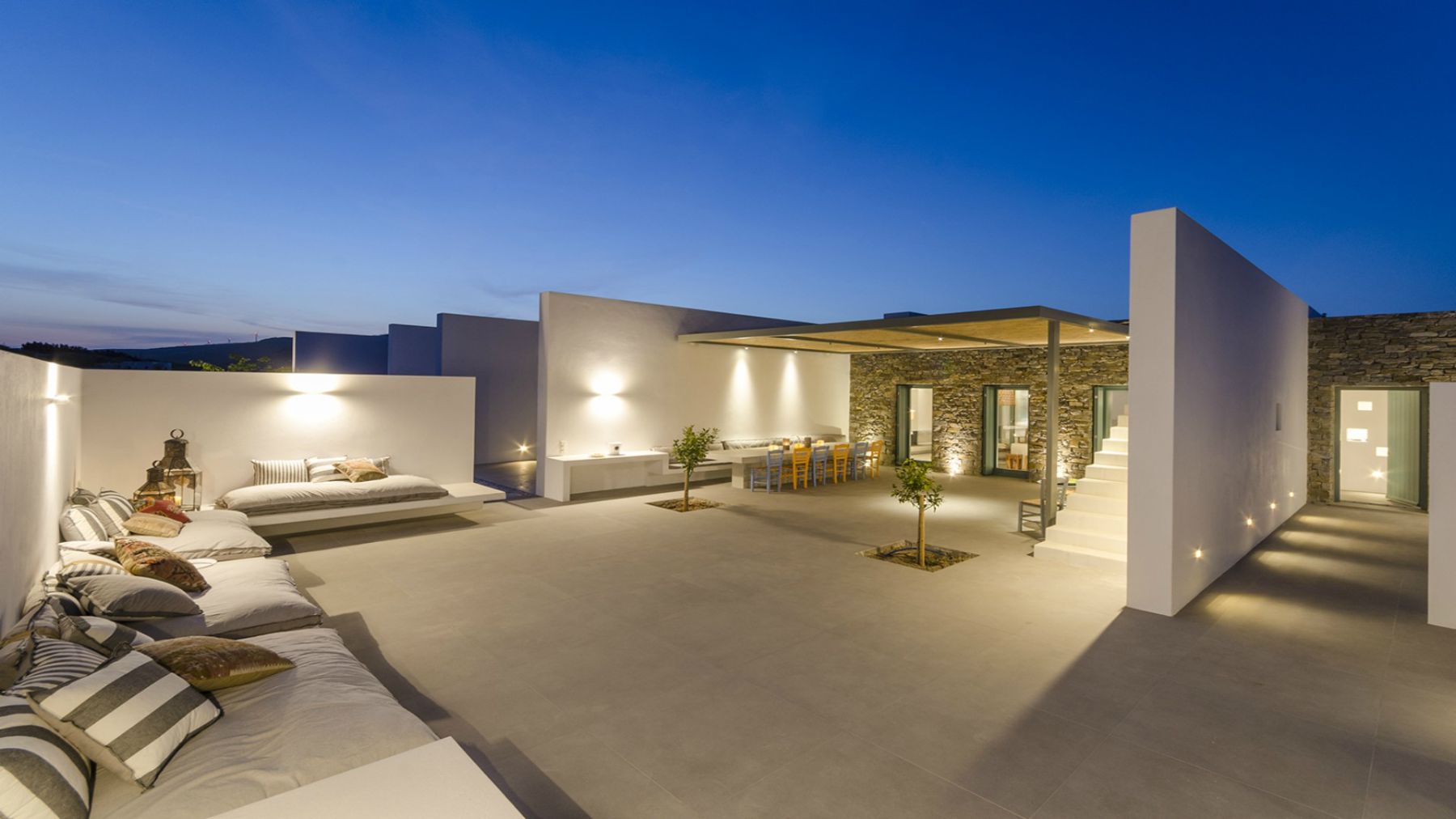 Terrace with seating in the evening at Villa Nisi, Paros