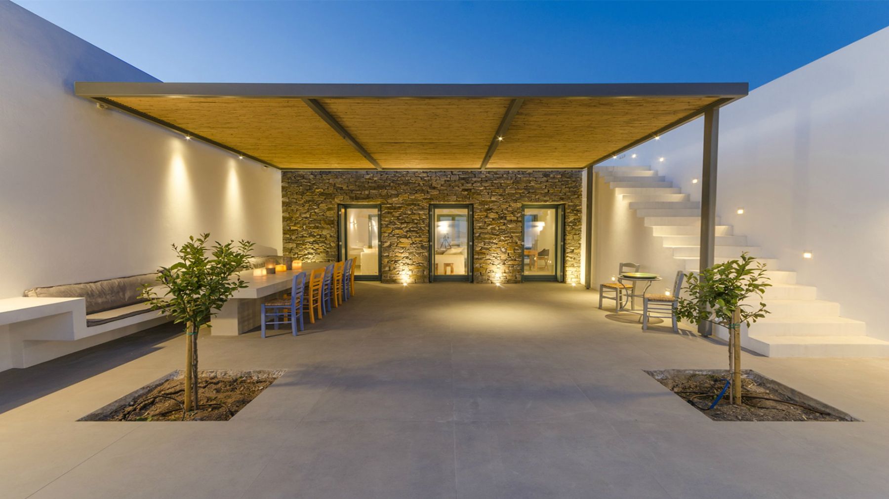 Terrace with seating in the evening at Villa Nisi, Paros