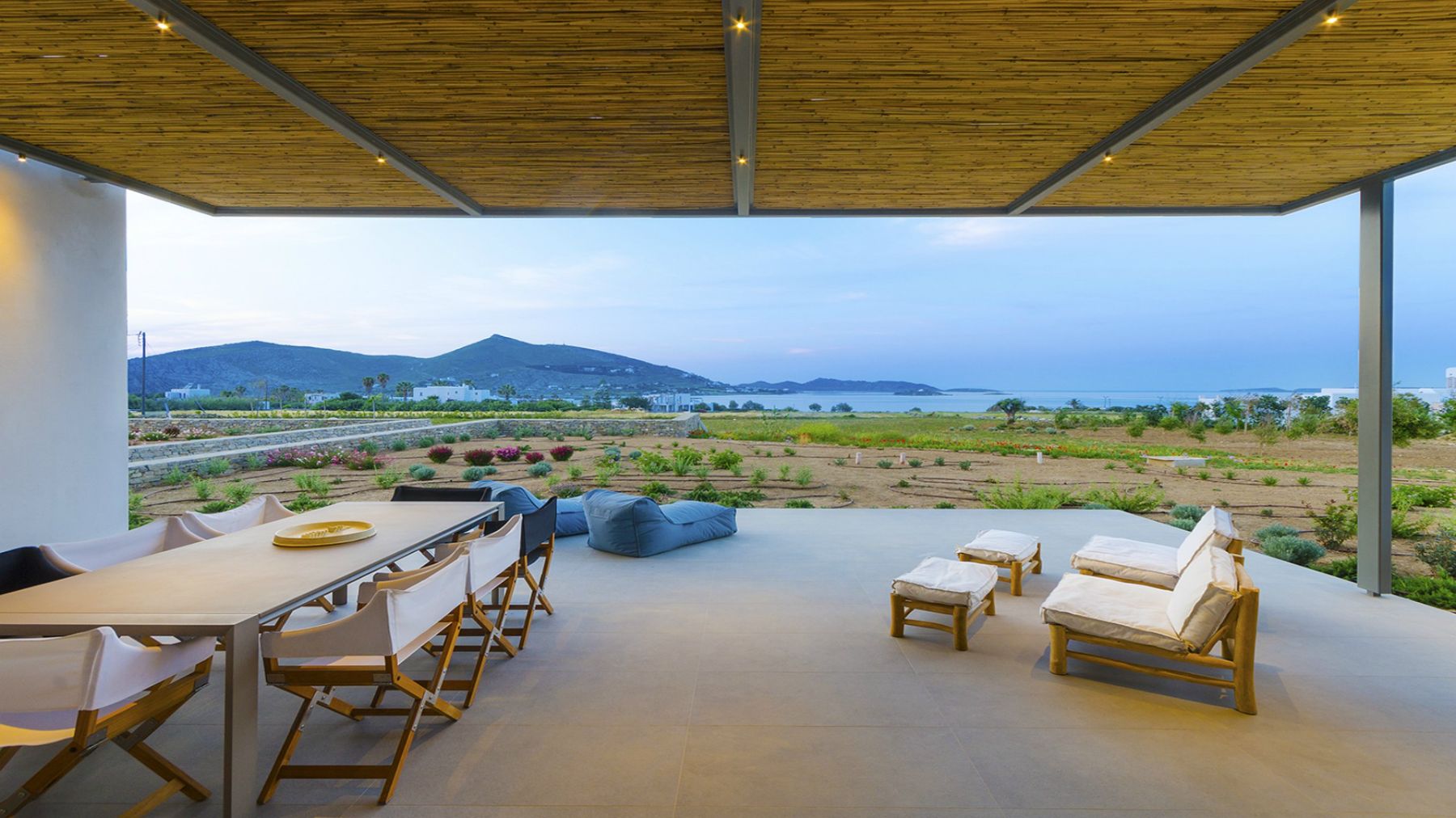 Terrace with seating and sea view at Villa Nisi, Paros