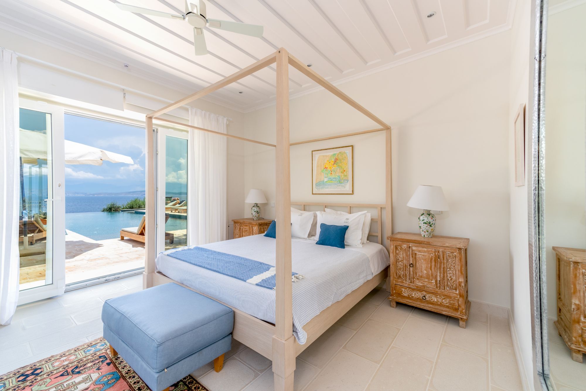 Double bedroom with four poster bed at Villa Ophelia