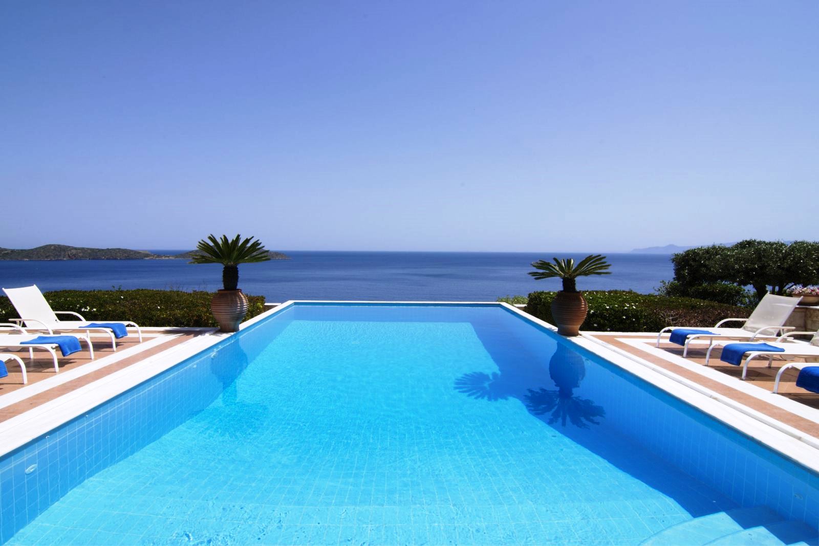 View over the length of the pool out onto the sea at Villa Selene in Crete