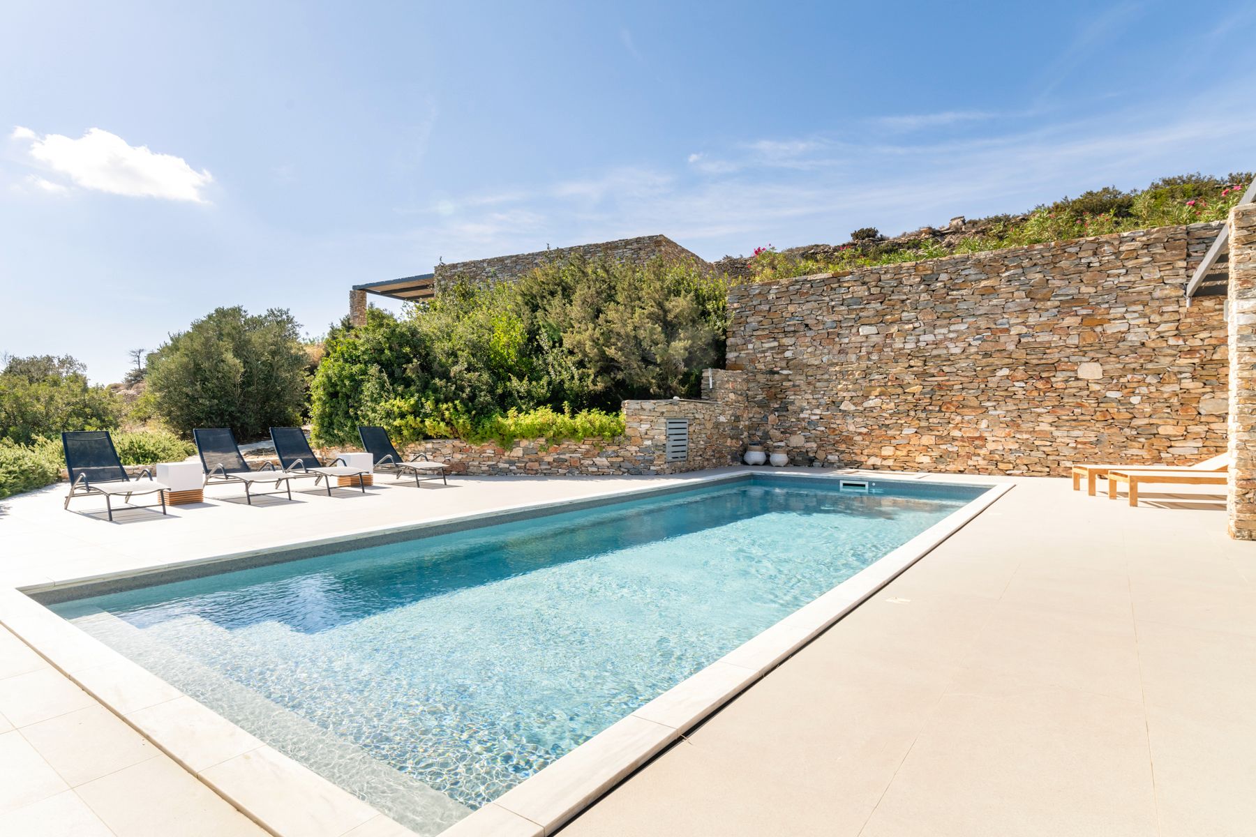 Pool with sun loungers at Villa Thalia, Sifnos