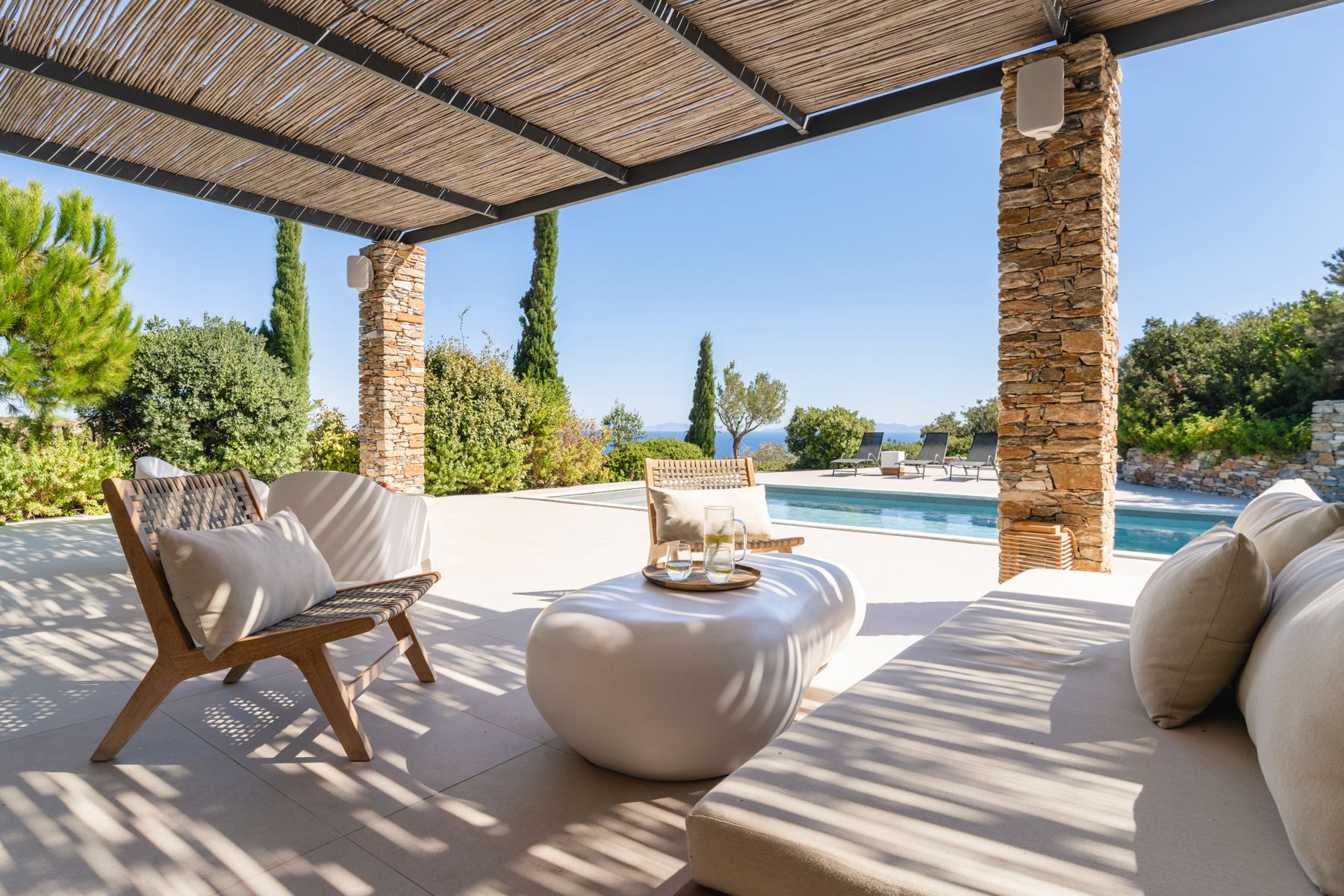 Covered pool terrace with seating at Villa Thalia, Sifnos