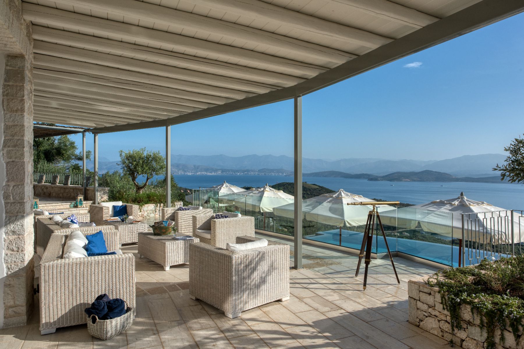 Terrace with seating and sea view at Villa Thea, Corfu