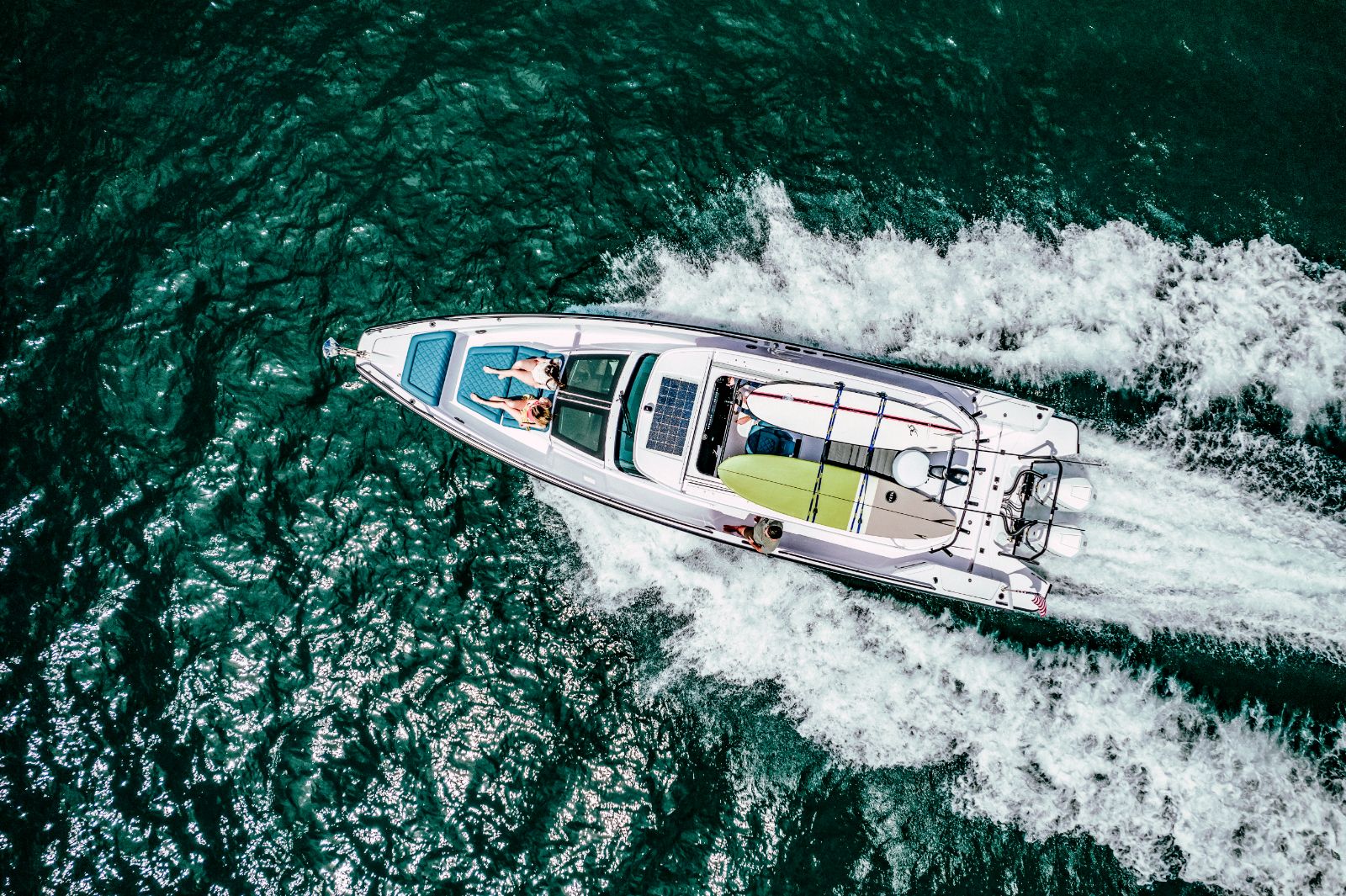 Guests on the deck of an Axopar 37 speedboat near Paros, Greece