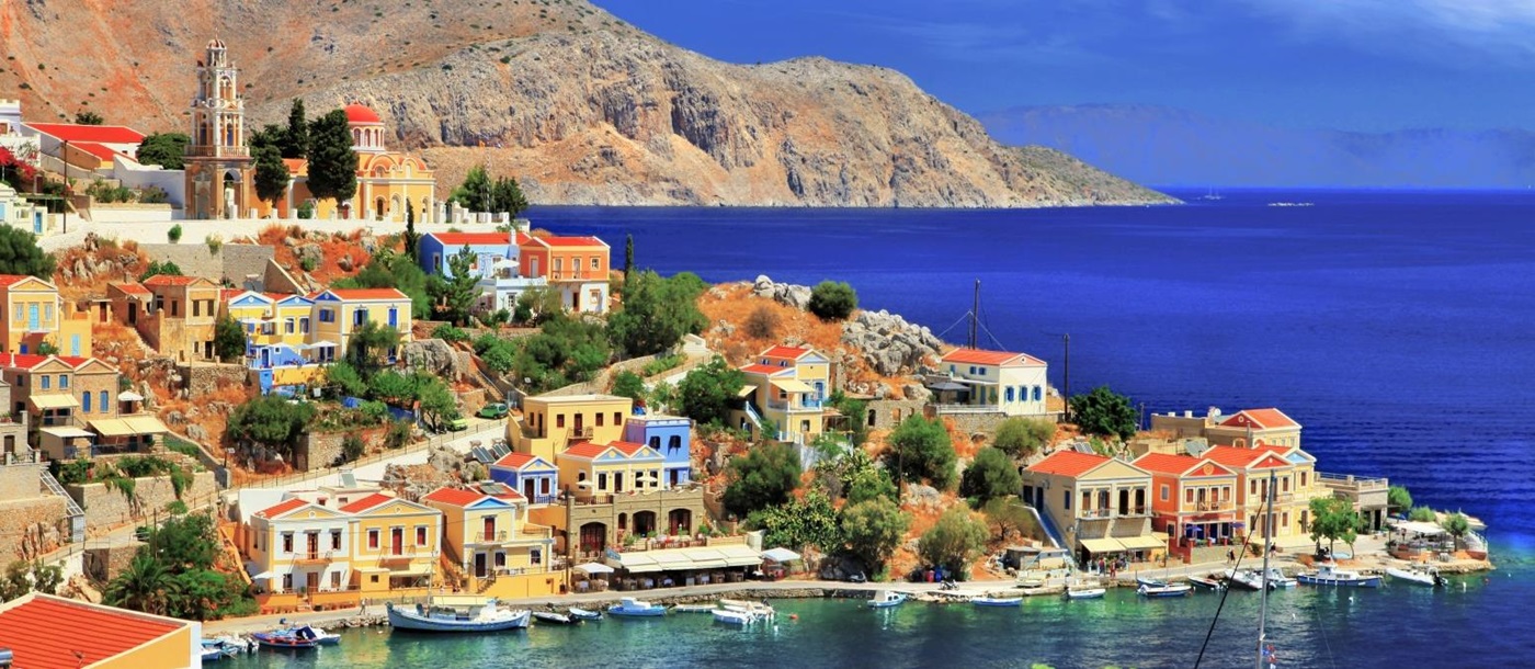 View of Symi Island with a cove and orange and yellow houses