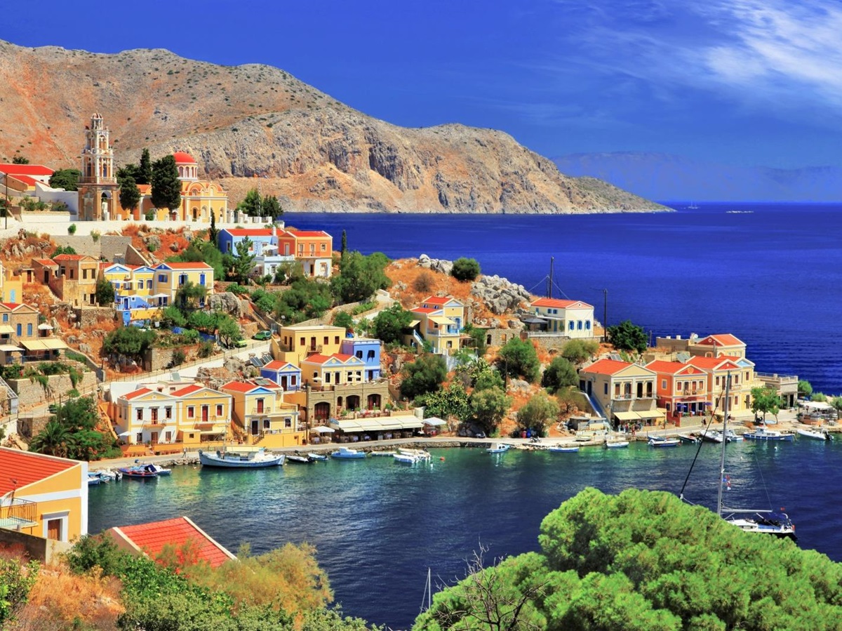 View of Symi Island with a cove and orange and yellow houses