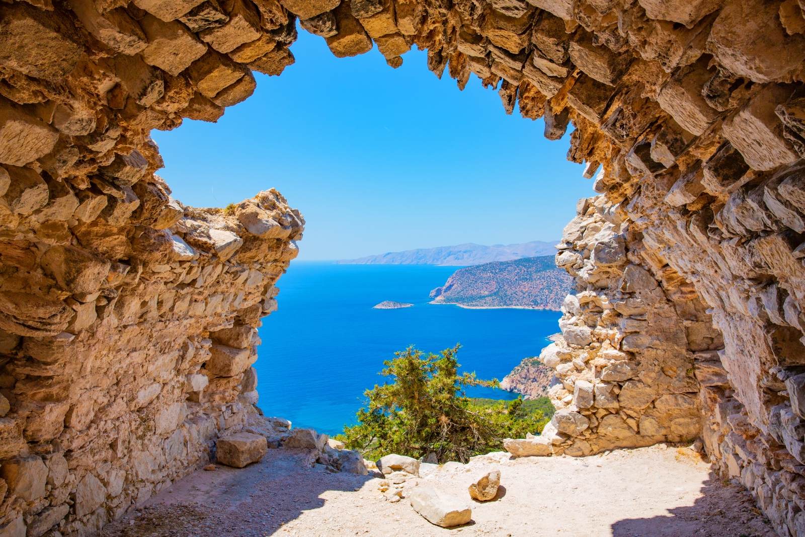 View from inside a brick tunnel towards the sea