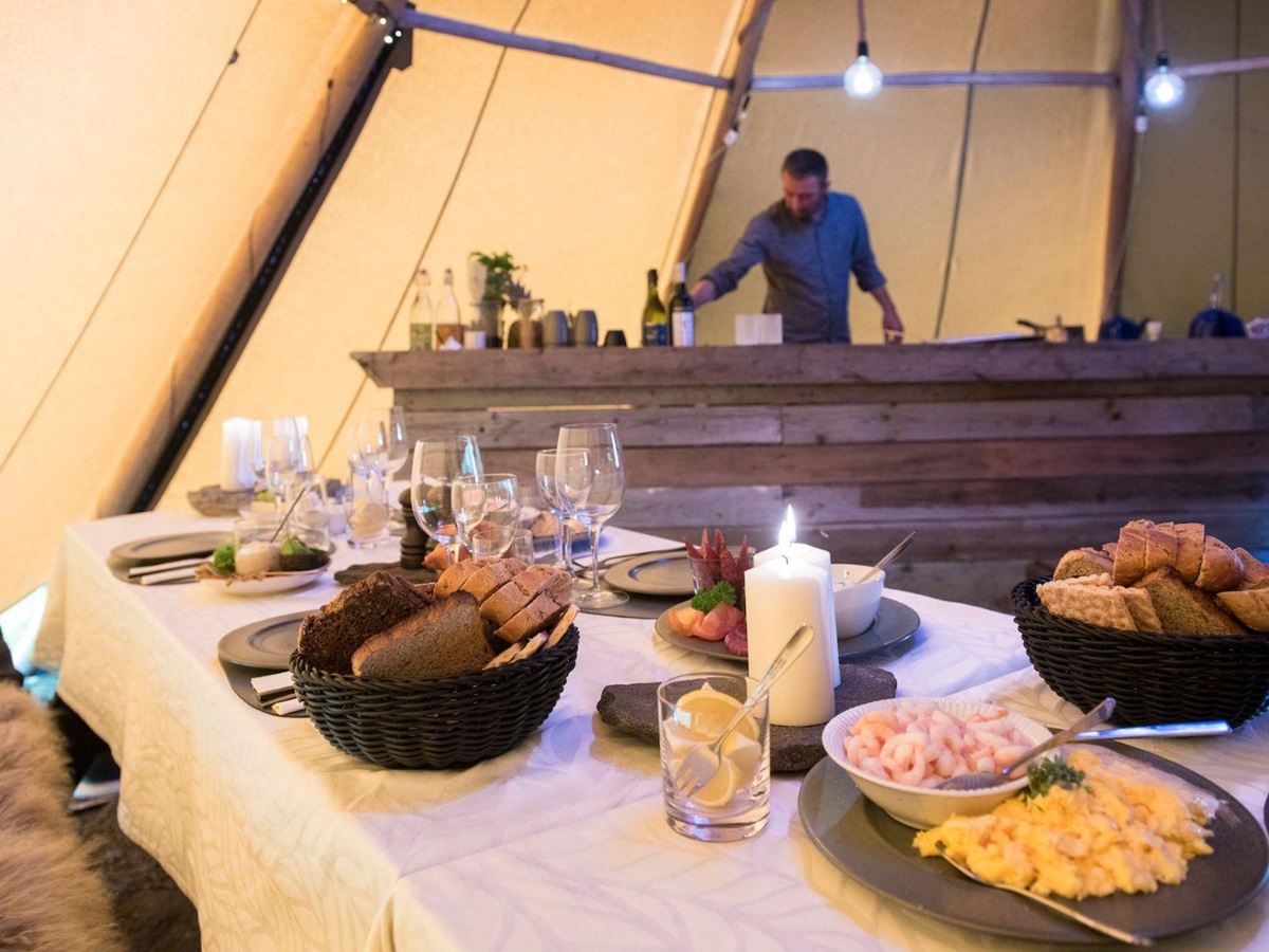 Meal times in the cosy dining tent at Camp Kiattua in Greenland