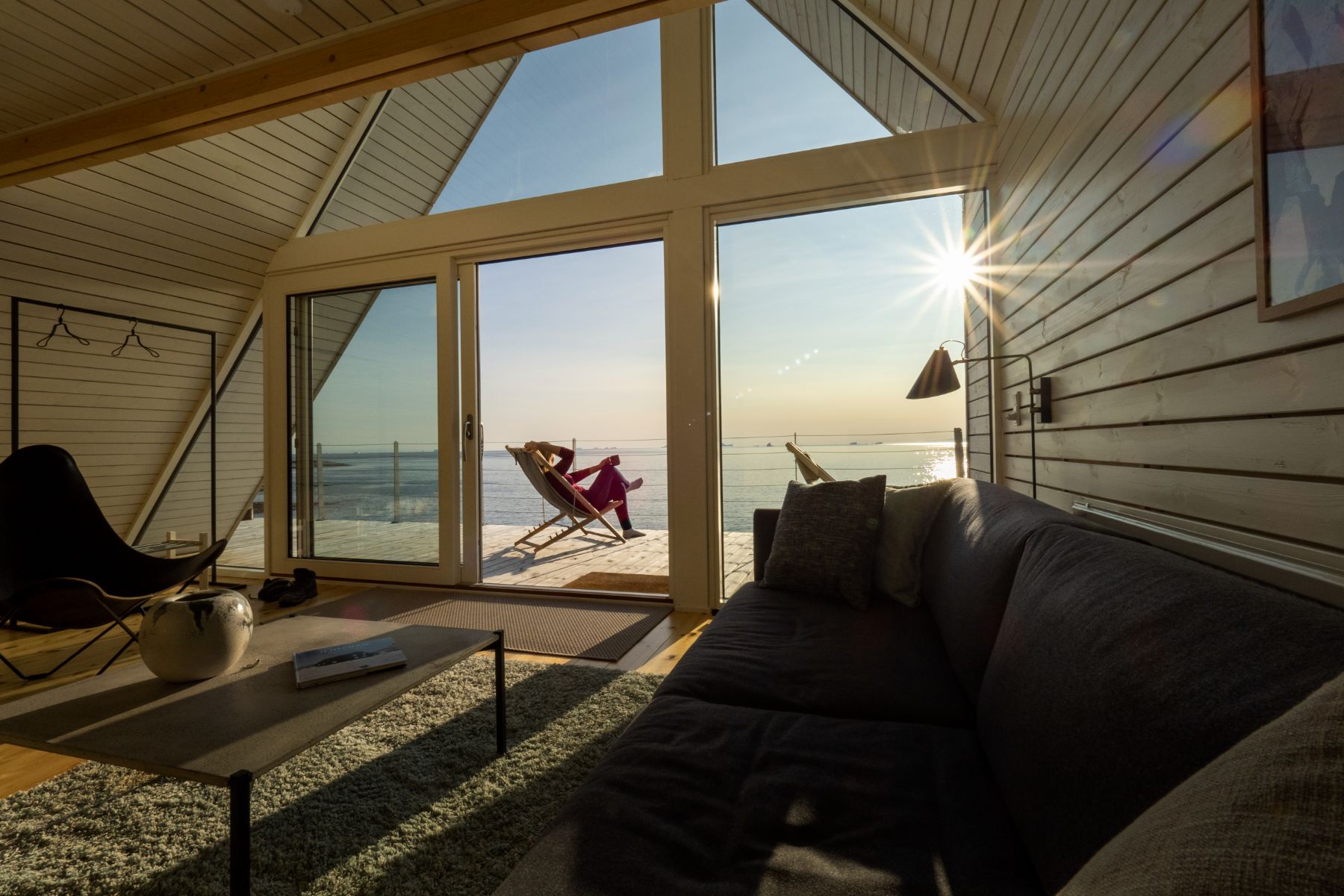Living area and terrace of a bungalow at Ilimanaq Lodge Greenland