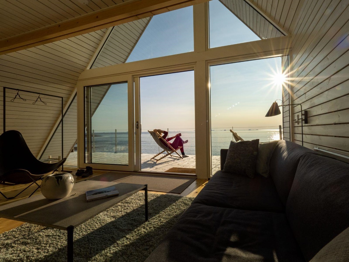 Living area and terrace of a bungalow at Ilimanaq Lodge Greenland