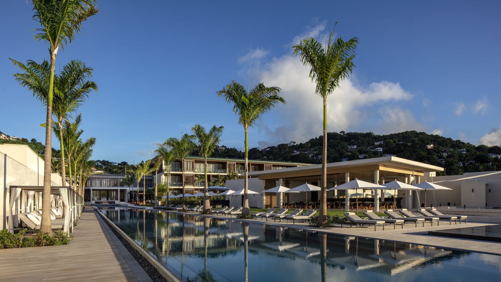 Swimming pool and restaurant at Silversands hotel in Grenada