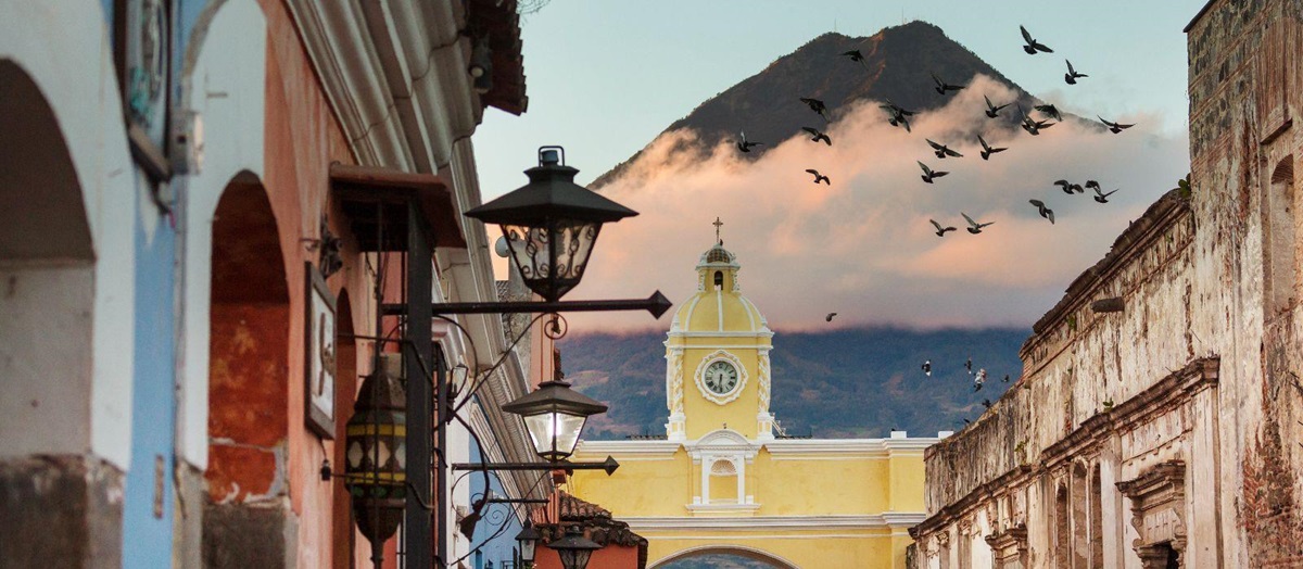 The streets of Antigua in Guatemala with a volcano backdrop