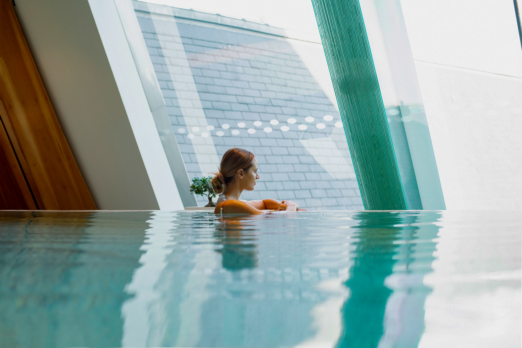 A woman in the swimming pool at Four Seasons Gresham Palace in Budapest