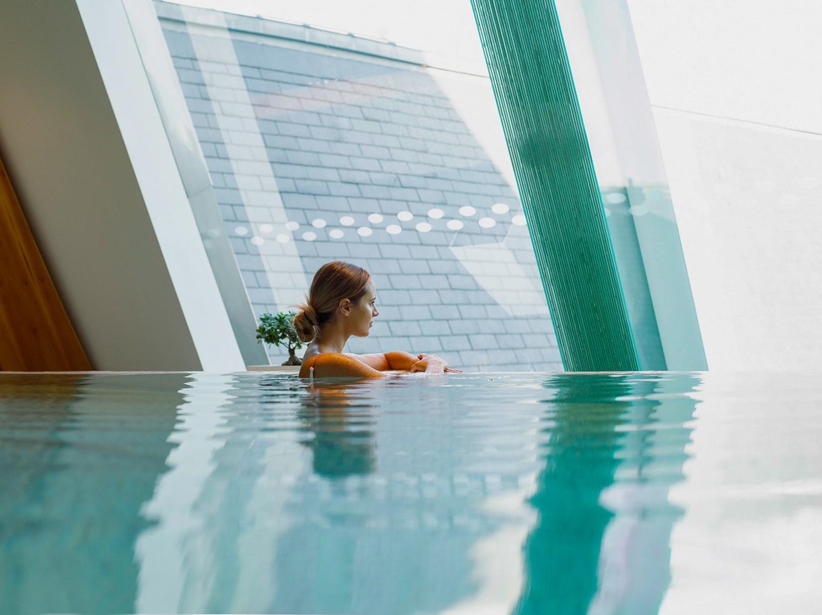A woman in the swimming pool at Four Seasons Gresham Palace in Budapest