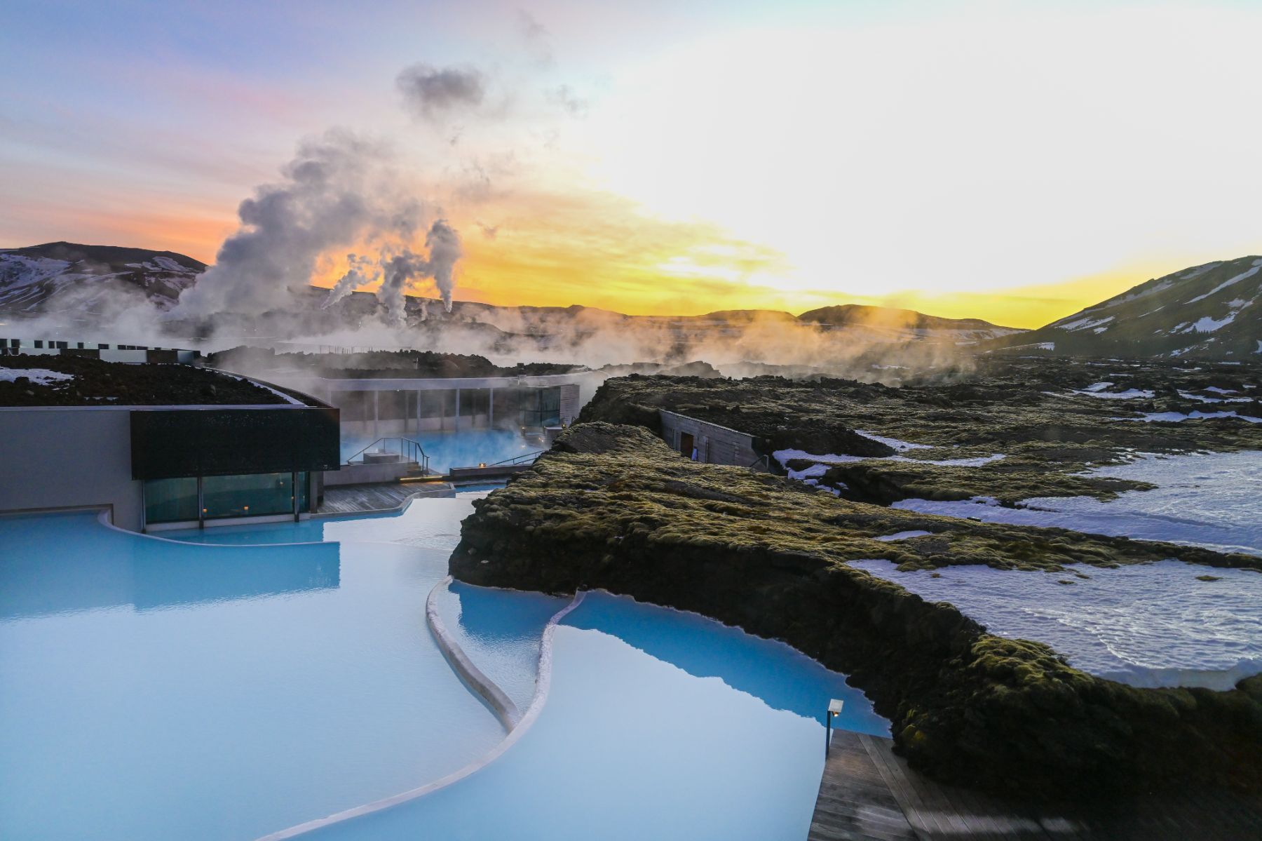 The thermal waters of The Retreat at Blue Lagoon hotel in Iceland at sunset