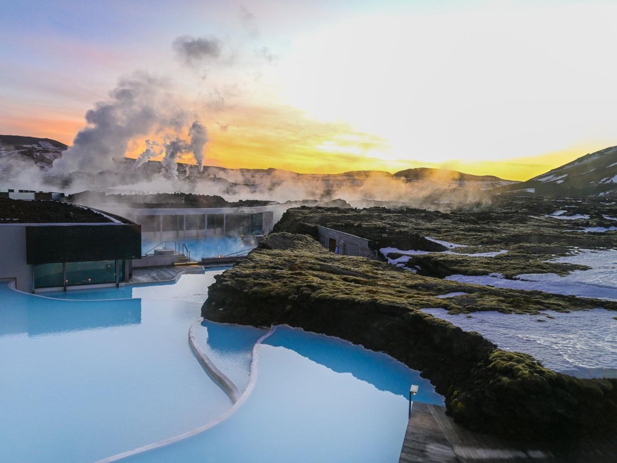 The thermal waters of The Retreat at Blue Lagoon hotel in Iceland at sunset