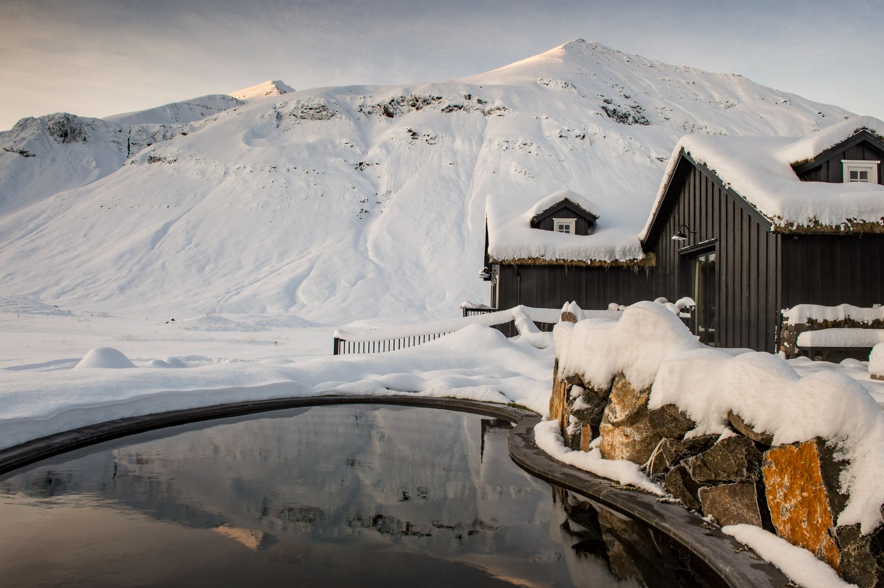 Swimming pool during the snow at Deplar Farm in Iceland