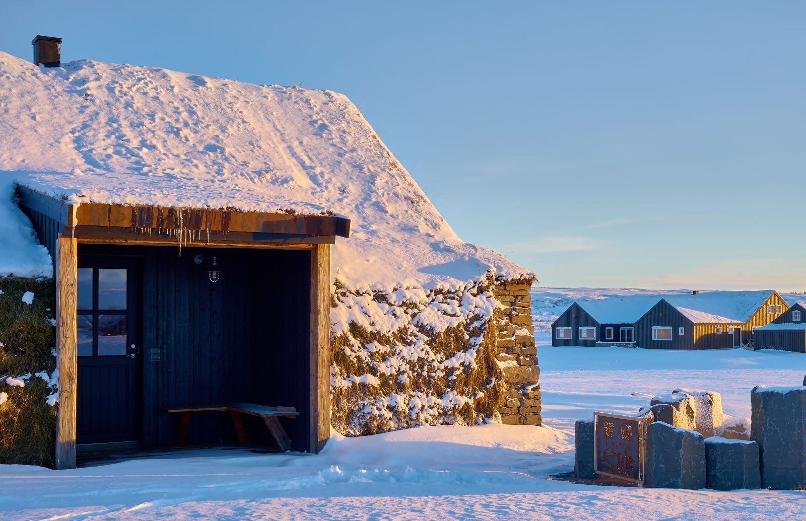 A turhouse with geothermal pool in the snow at Torfhus Retreat hotel in Iceland