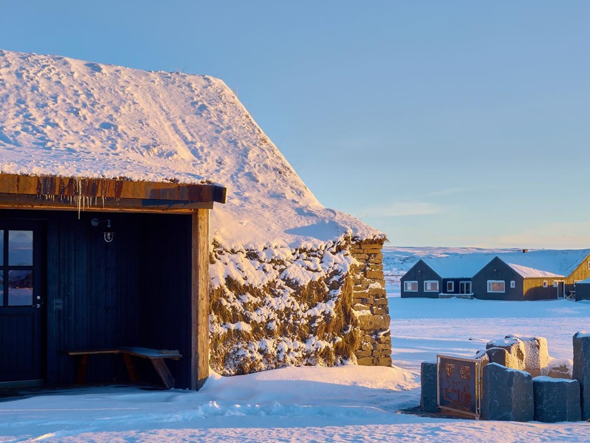 A turhouse with geothermal pool in the snow at Torfhus Retreat hotel in Iceland