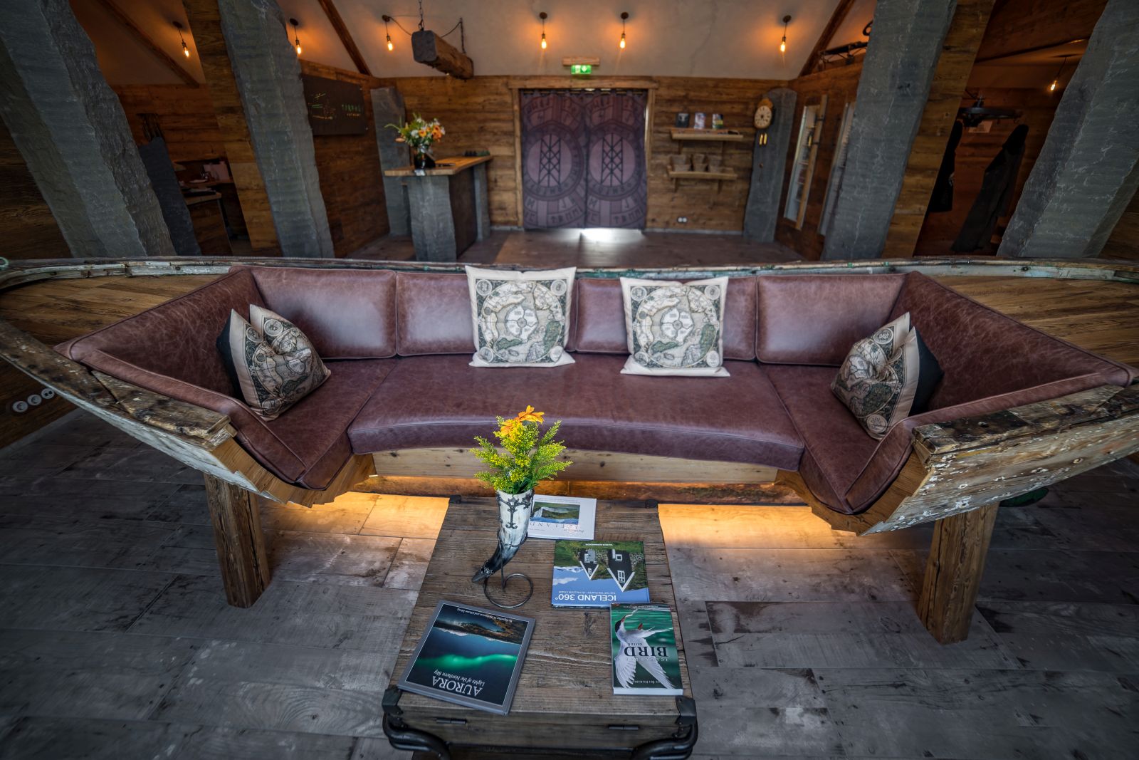 Wooden boat converted into a sofa at Torfhus Retreat hotel in Iceland