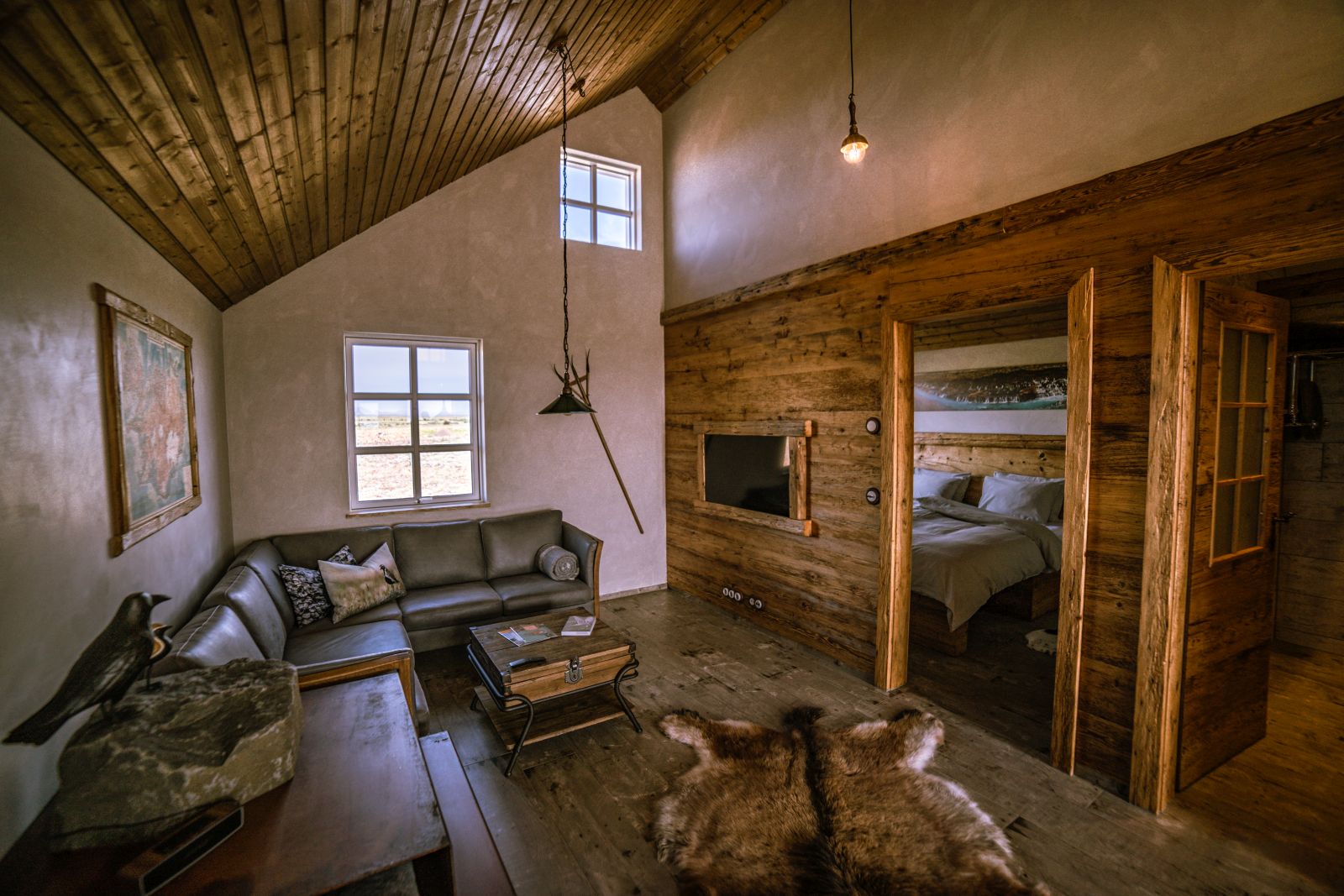 Living area of a guest room at Torfhus Retreat hotel in Iceland