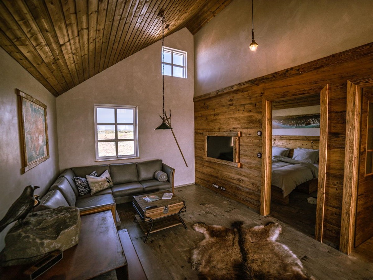 Living area of a guest room at Torfhus Retreat hotel in Iceland