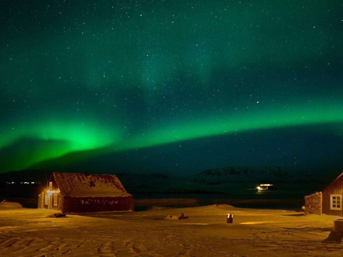 Northern Lights over the Torfhus Retreat hotel in Iceland