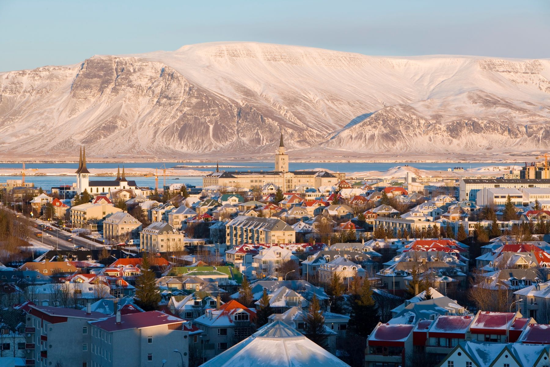 Rooftops of Reykjavik with mountains in the distance