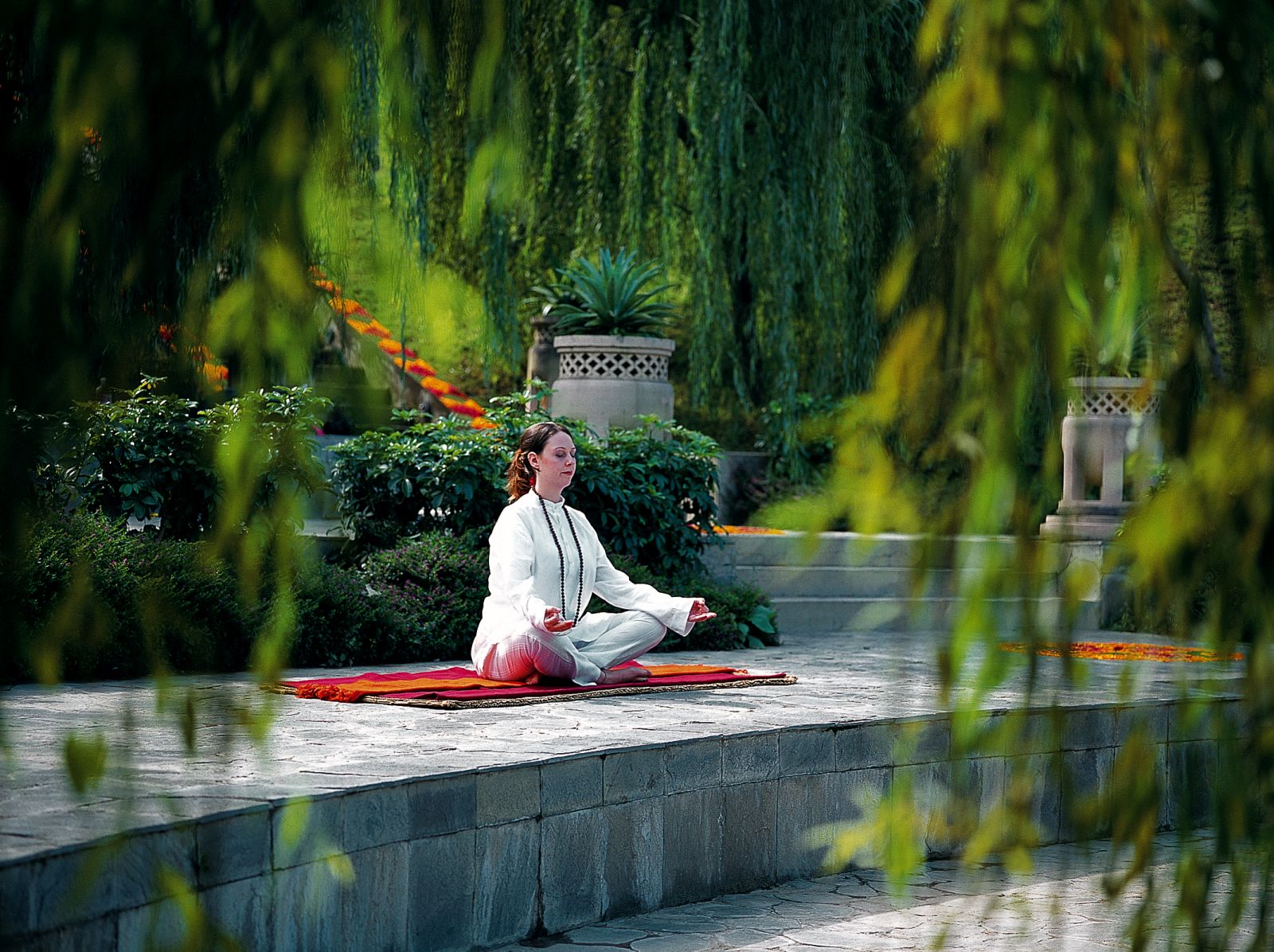 Guest meditating in the grounds of Ananda in the Himalayas India