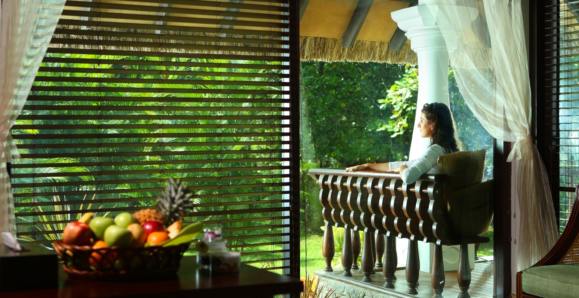 a woman sitting in a double bedroom at Carnoustie, India
