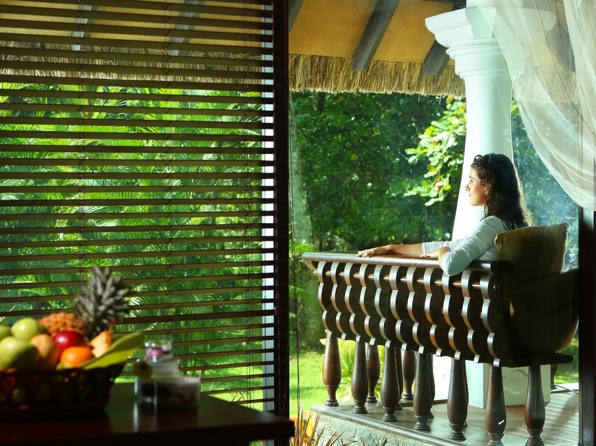 a woman sitting in a double bedroom at Carnoustie, India