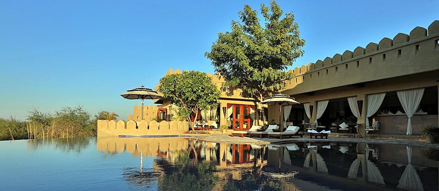 The swimming pool at Mihir Garh hotel in India