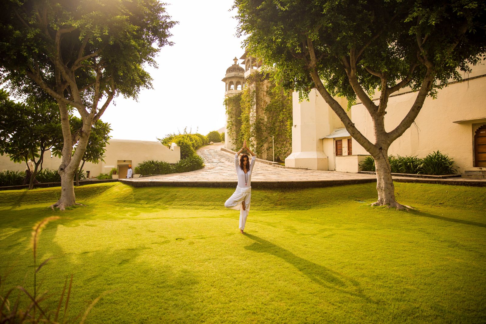 Yoga in the grounds of the RAAS Devigarh hotel near Udaipur India
