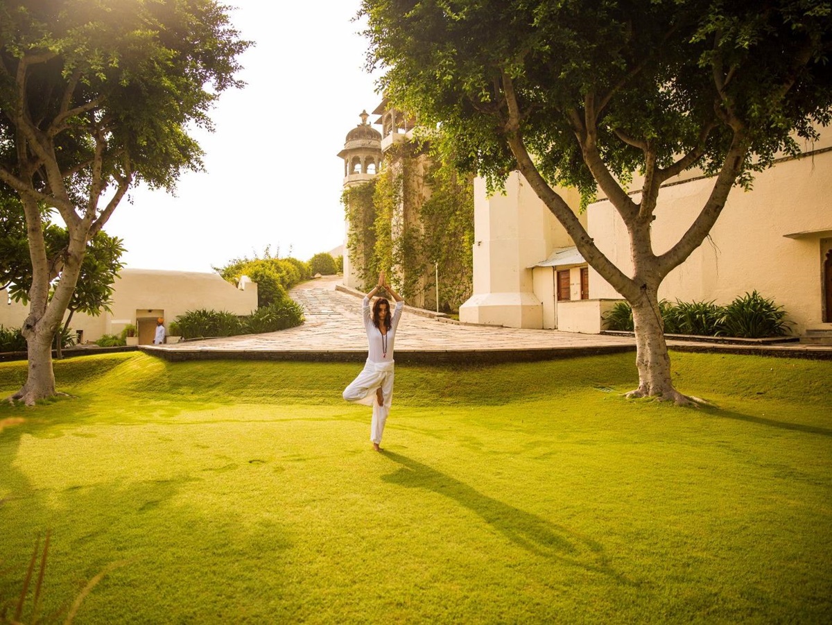 Yoga in the grounds of the RAAS Devigarh hotel near Udaipur India