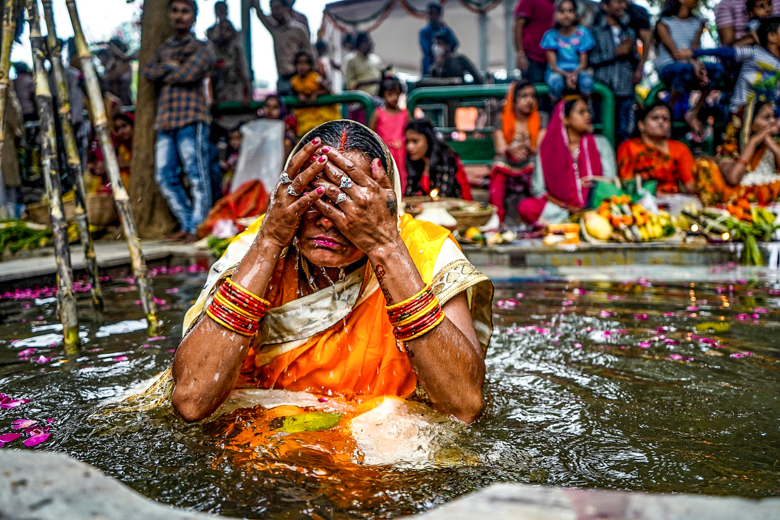 A woman bathing in the Haridwar River during Kumbh Mela festival