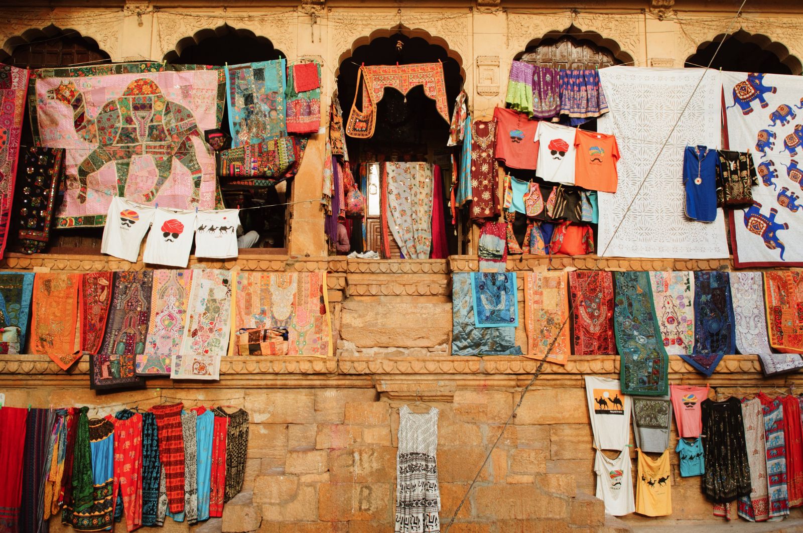 Colourful clothes hanging from washing lines in the narrow streets of Jaisalmer, Rajasthan