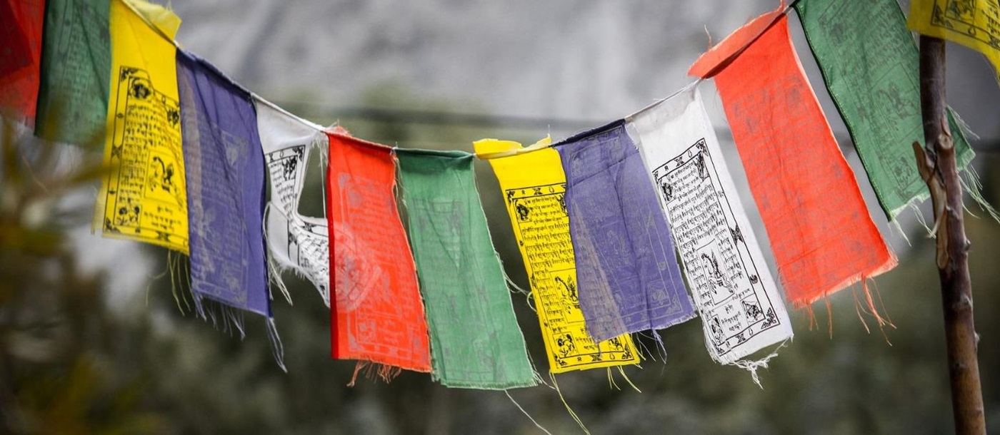 Hanging prayer flags in Ladakh, India