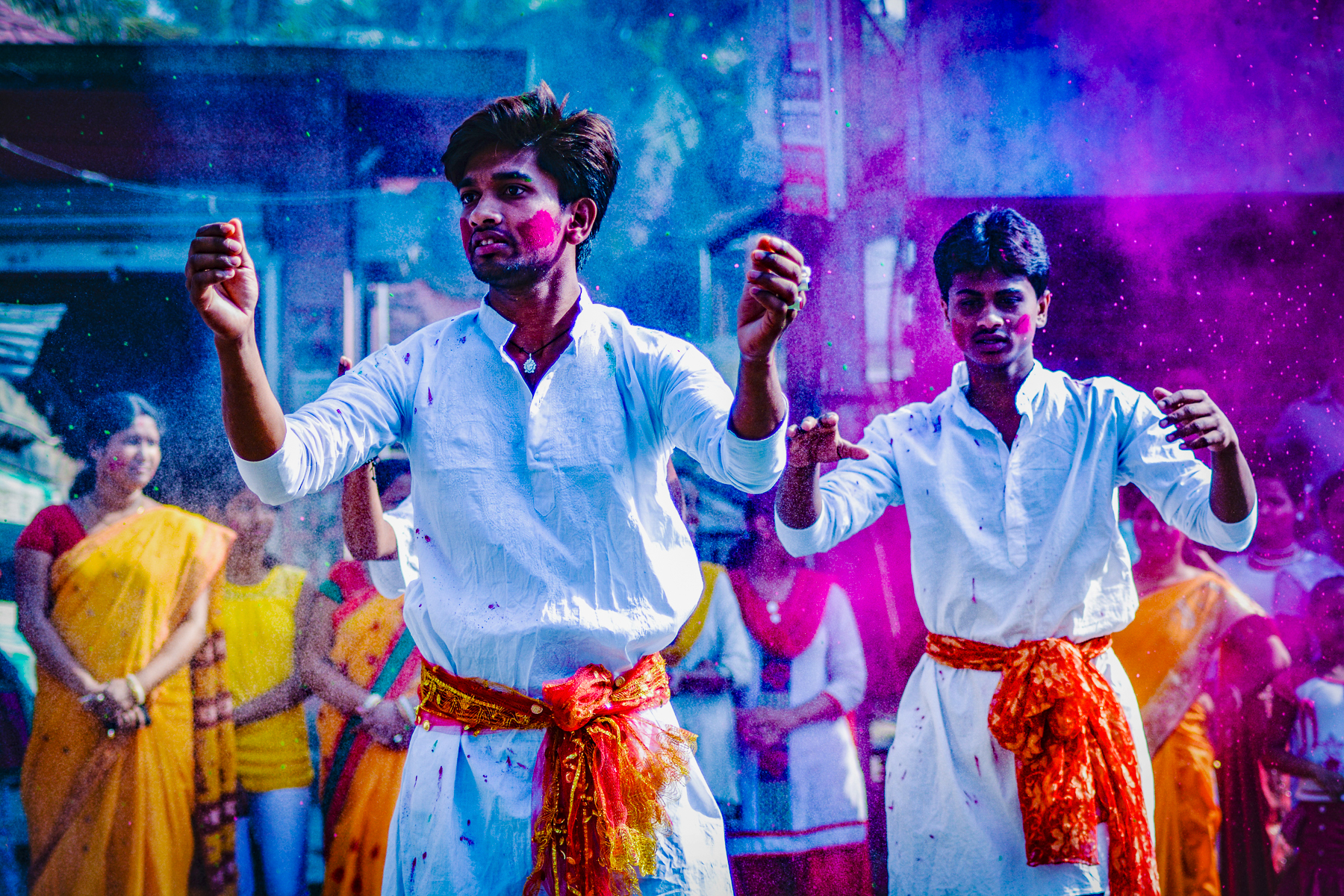 Men celebrating with colourful paint in India