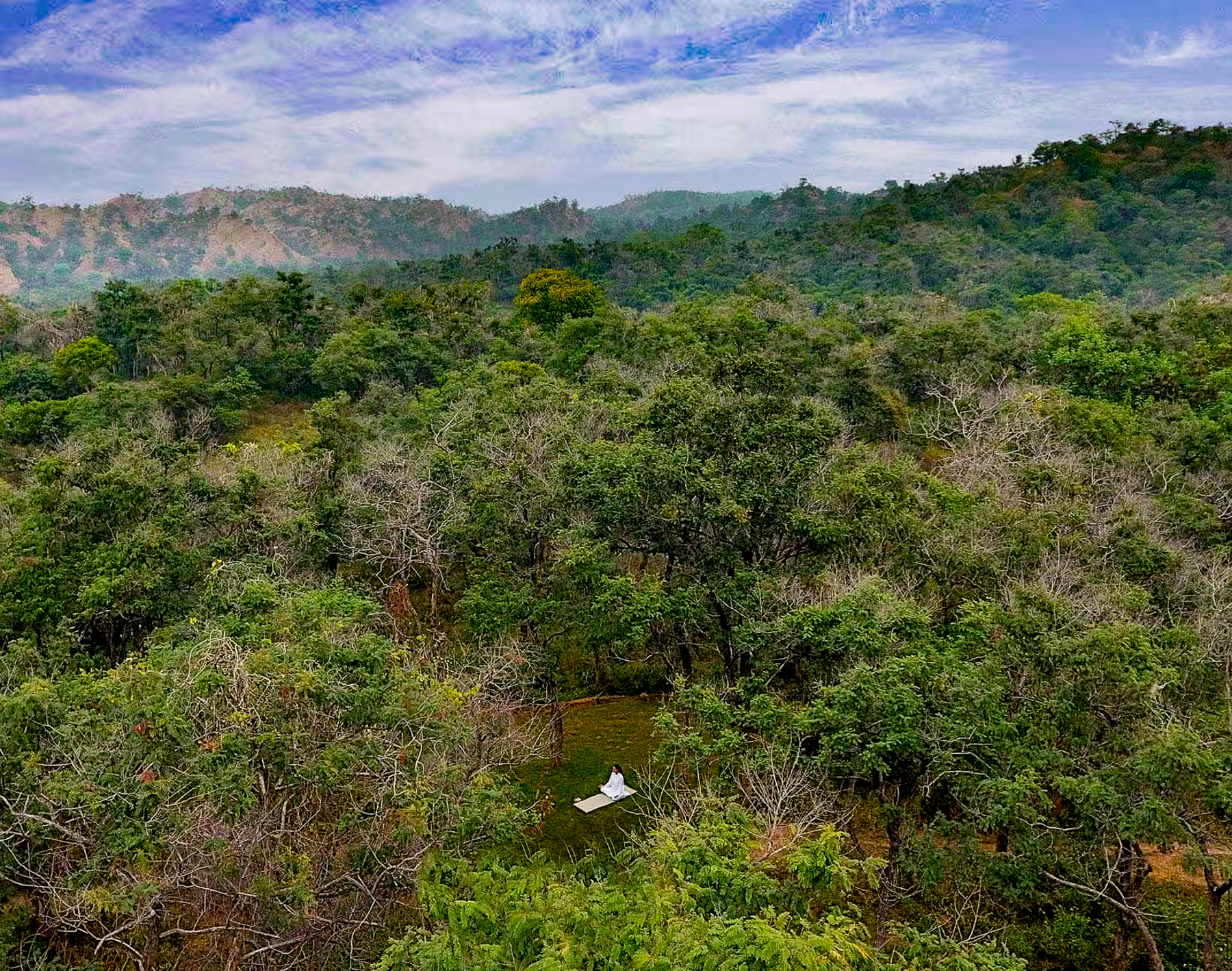 Yoga in a forest clearing at Oberoi Sukhvilas 