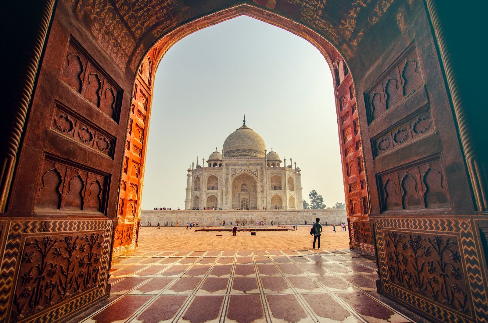 View of the Taj Mahal in India through an ornate doorway