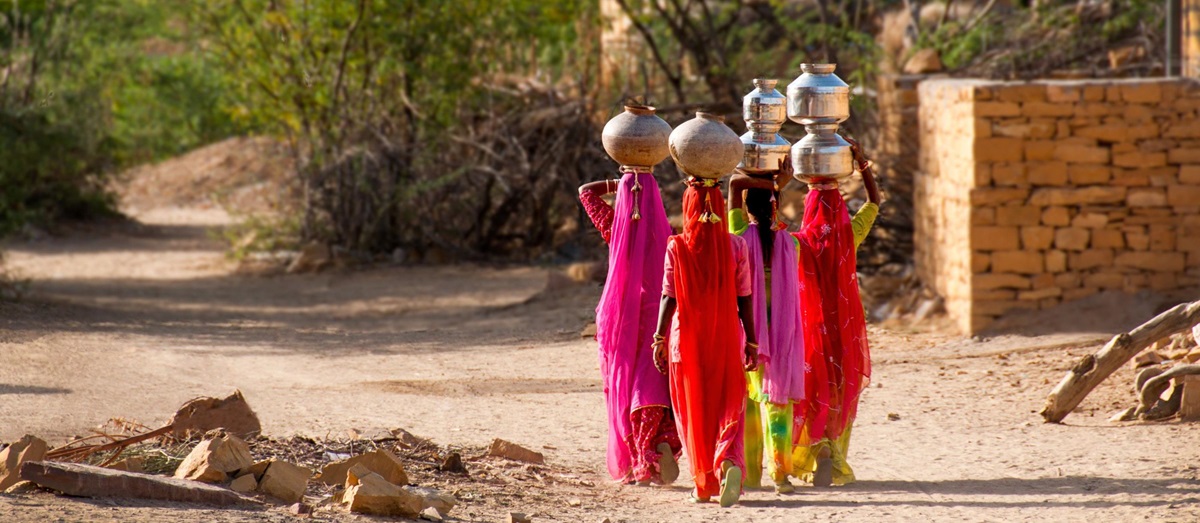 Women carrying water, India