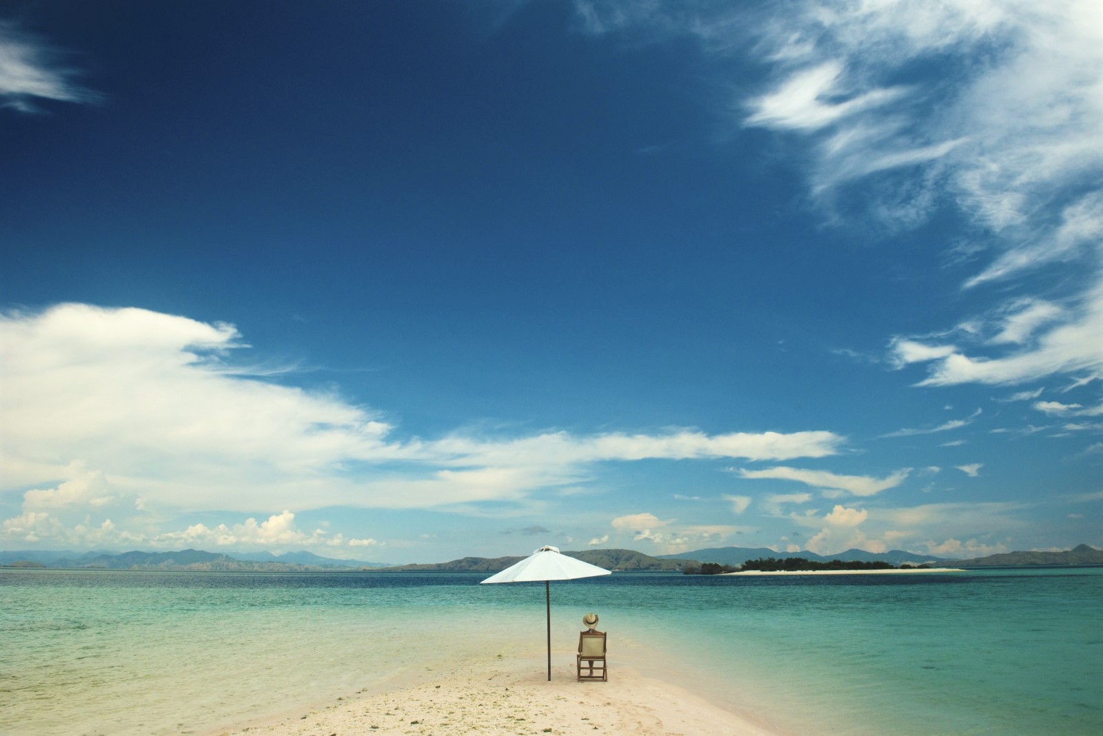 One person sits on a long white sandbank, Alexa Indonesia