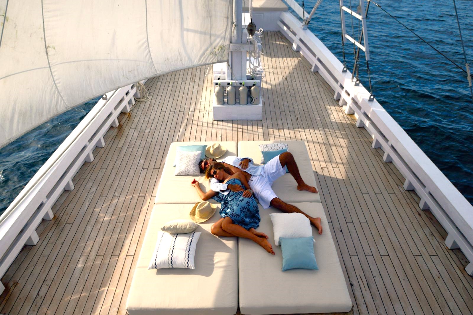 A couple on the deck of the Alexa phinisi in Indonesia