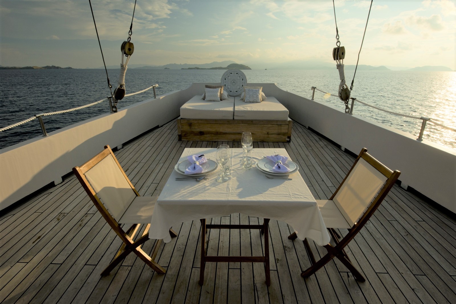 Outdoor dining set-up on the deck for two people on Alexa, Indonesia