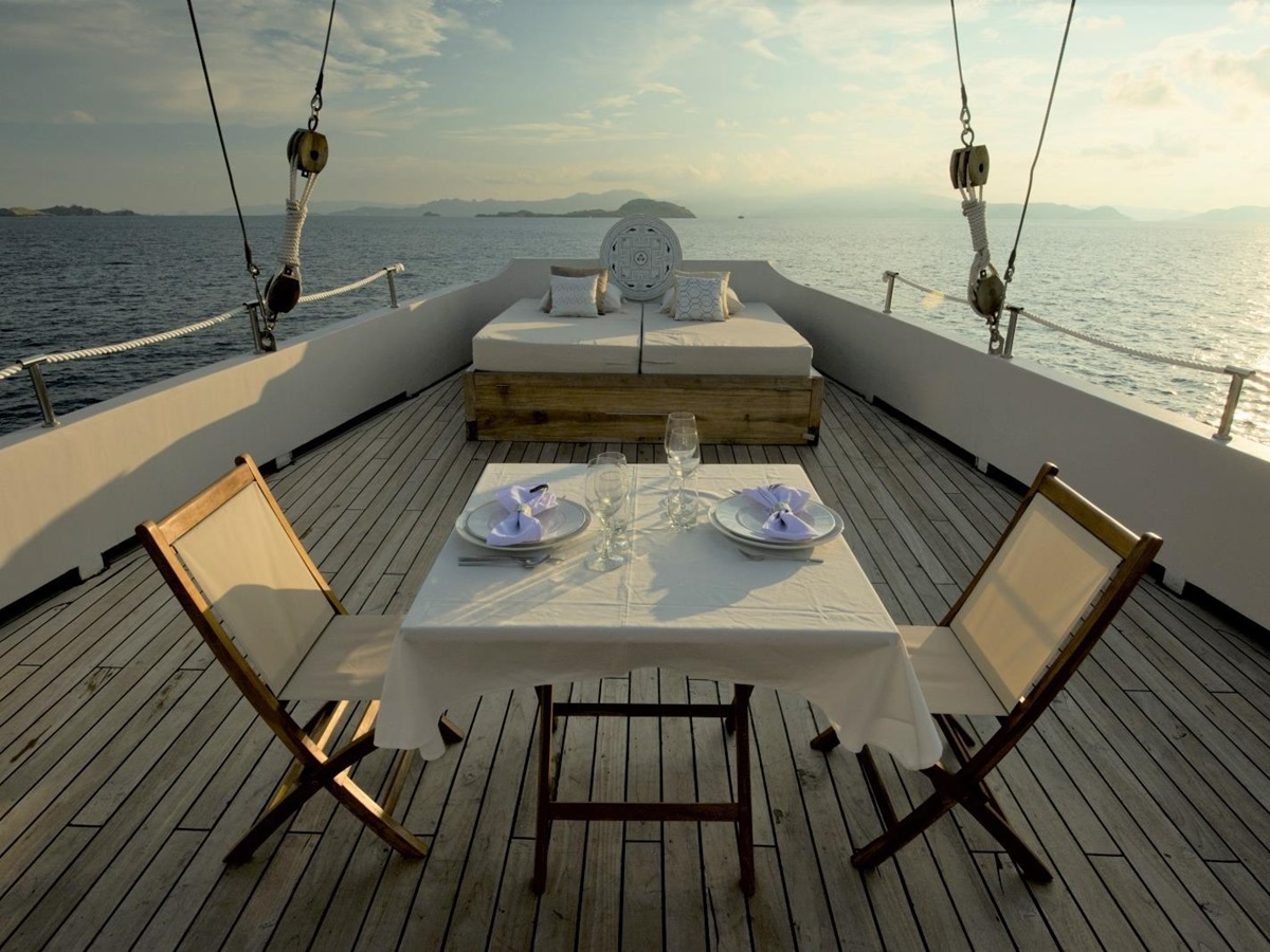 Outdoor dining set-up on the deck for two people on Alexa, Indonesia