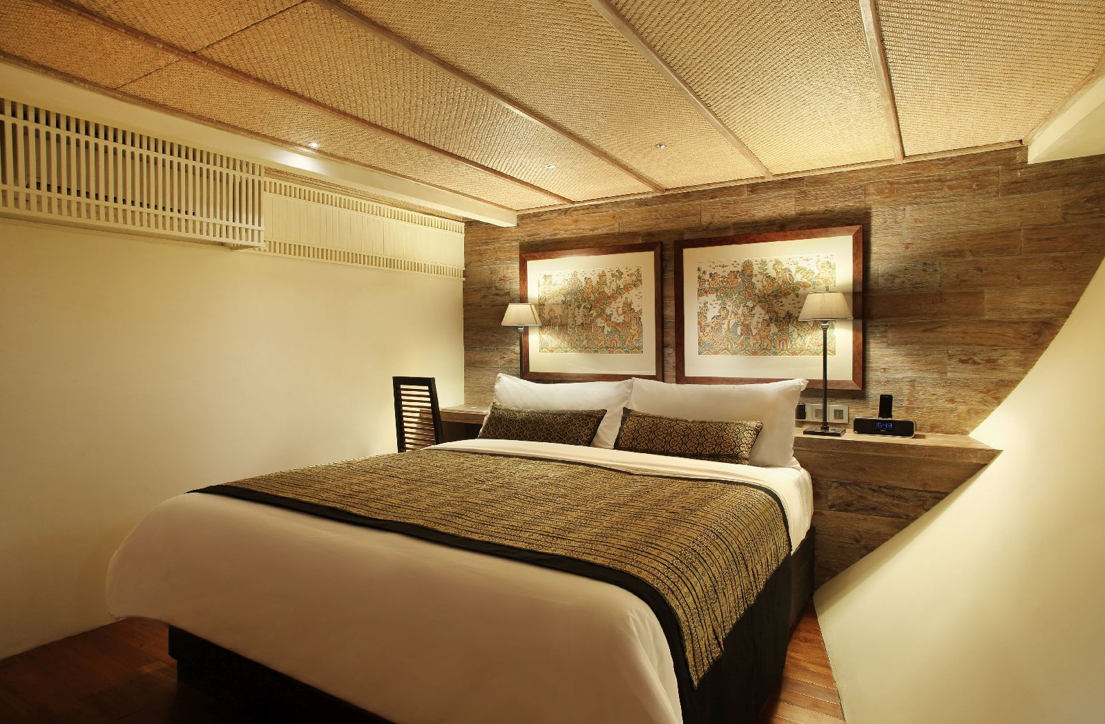 A luxurious guest suite on board the Alila Purnama phinisi yacht in Indonesia